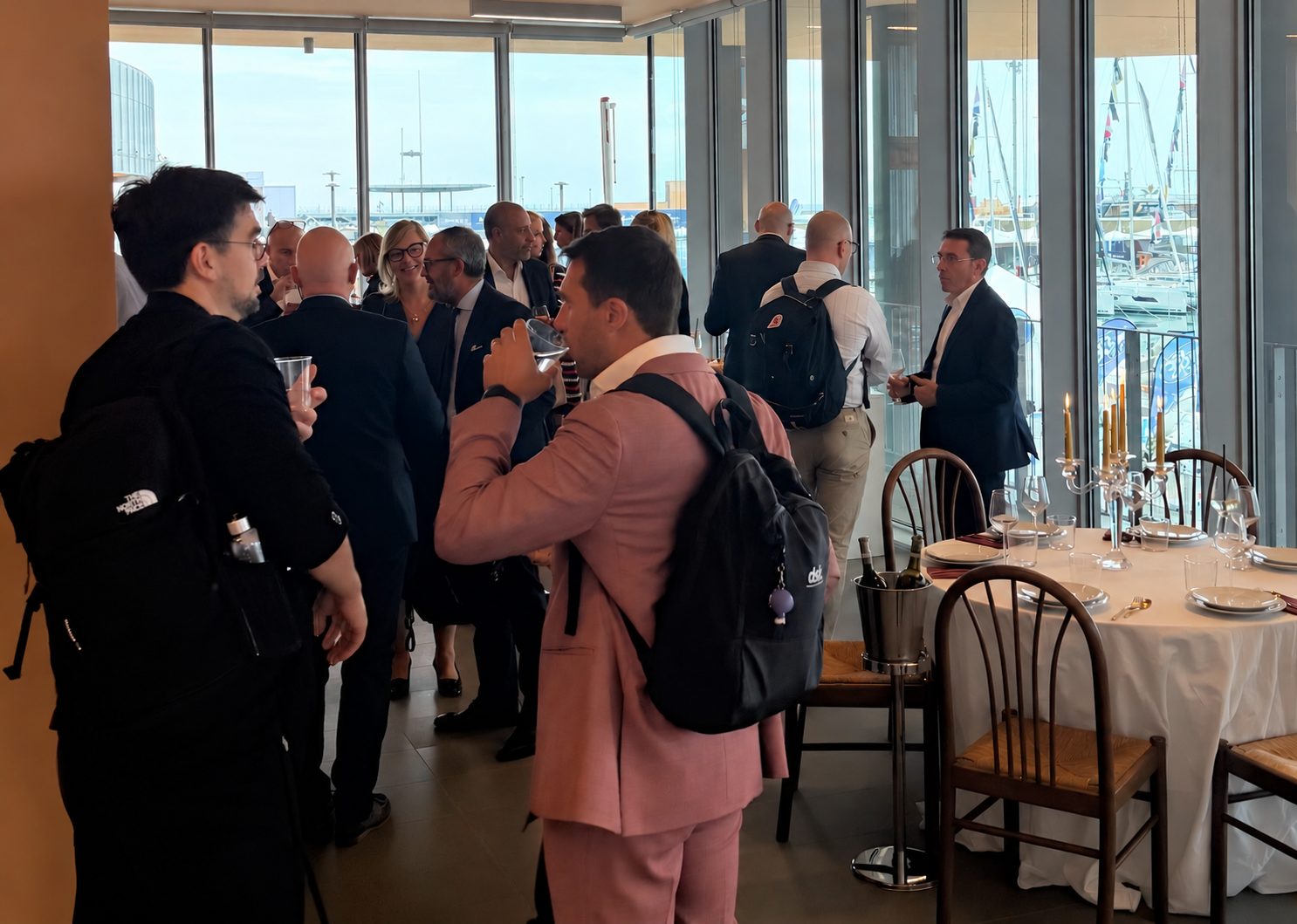Networking aperitivo overlooking the marina